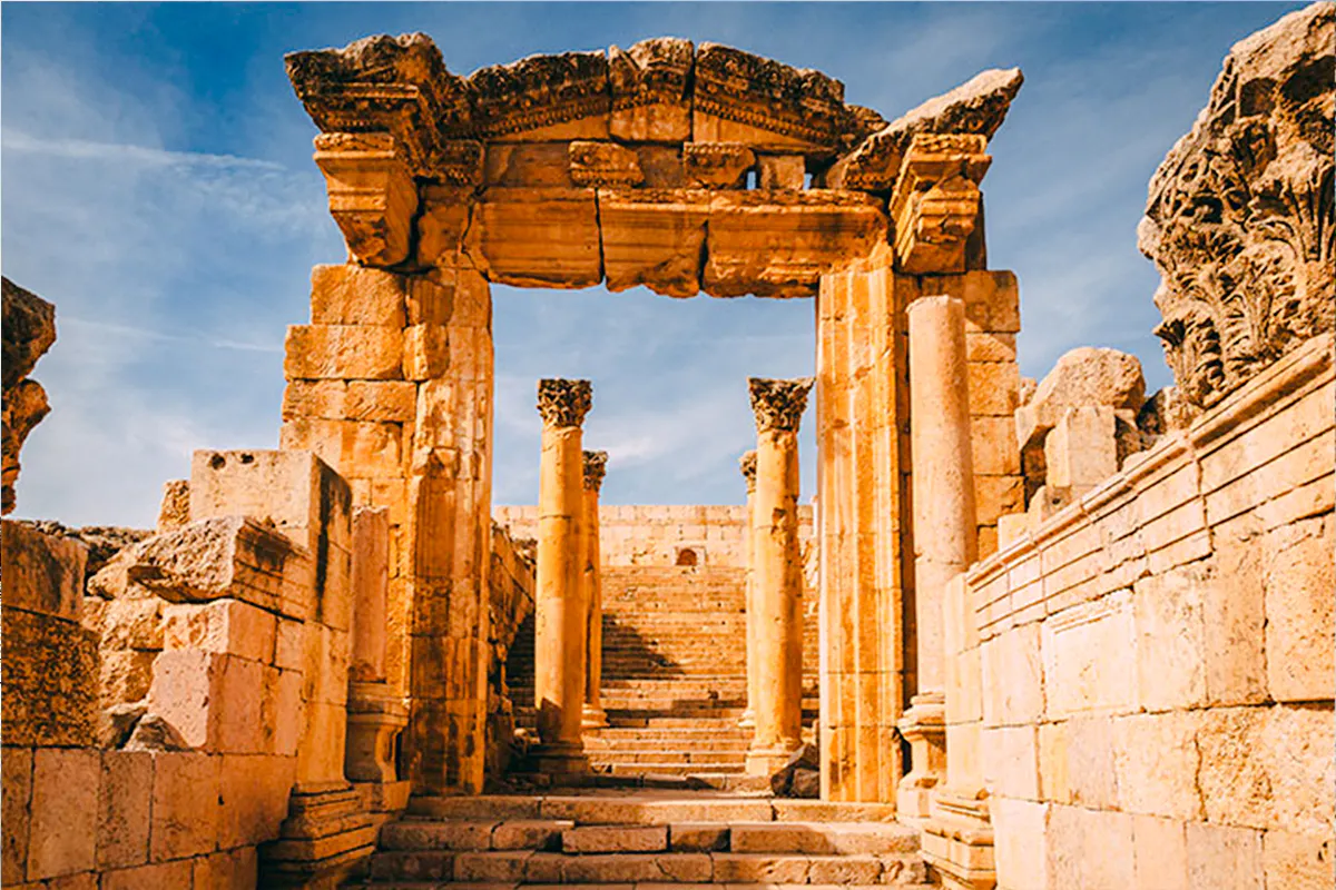 Roman ruins with stone columns and steps in Jerash, Jordan, viewed on a day trip from Amman.