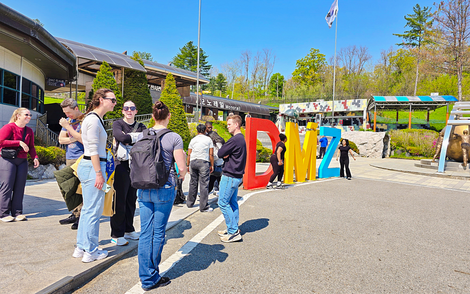 People gathered at the DMZ sign during a Seoul to DMZ tour in South Korea.