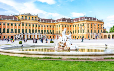 Fountain at Schönbrunn Palace Gardens with palace in the background, Vienna.