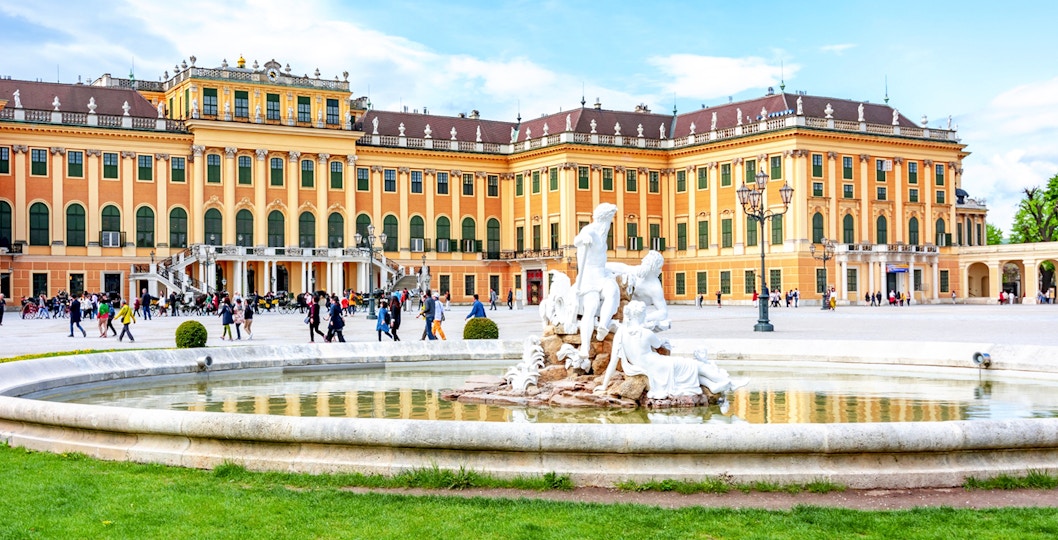 Fountain at Schönbrunn Palace Gardens with palace in the background, Vienna.