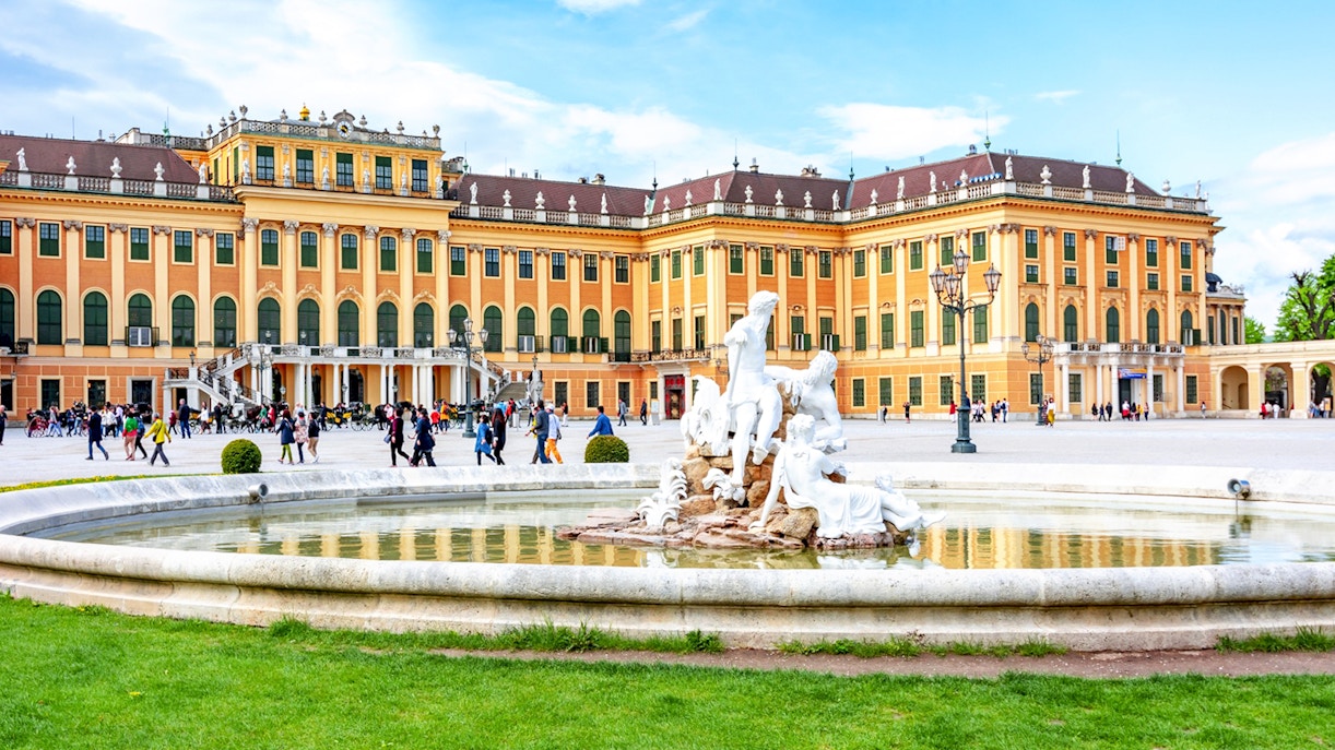 Fountain at Schönbrunn Palace Gardens with palace in the background, Vienna.