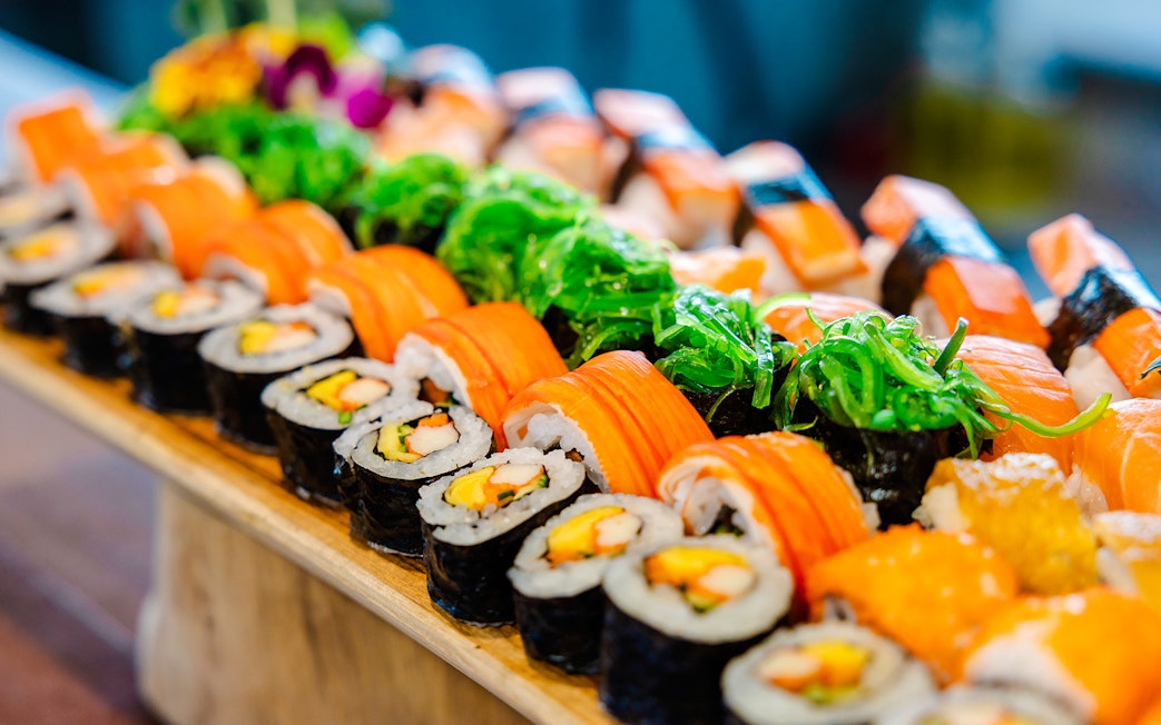 Assorted sushi rolls at a Thai lunch buffet.