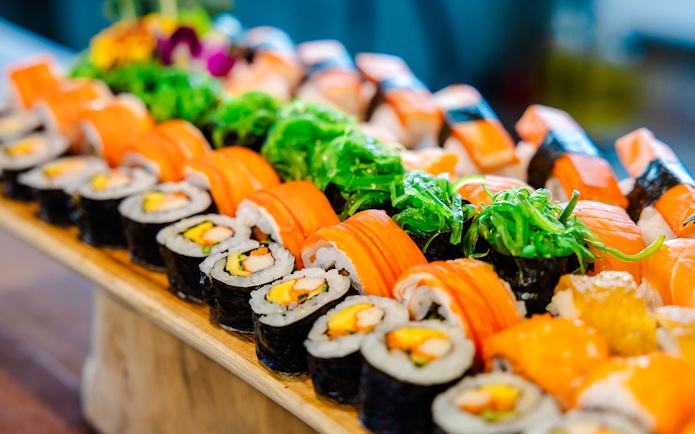 Assorted sushi rolls at a Thai lunch buffet.