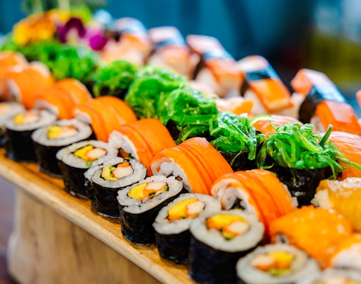 Assorted sushi rolls at a Thai lunch buffet.