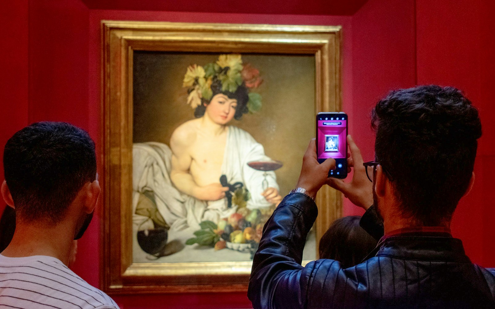 Bacchus painting by Caravaggio displayed in Uffizi Gallery, Florence.