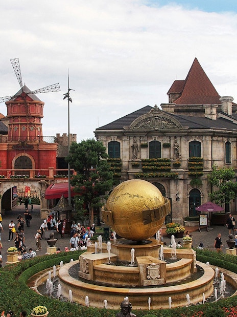 Central square in Ba Na Hills with globe fountain and European-style buildings.