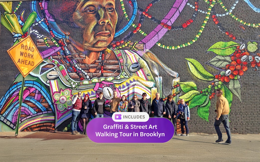 Brooklyn street art mural with a group of tourists on a walking tour.