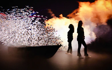 Guests at the Remastered audiovisual experience in Rotterdam with dynamic light display.