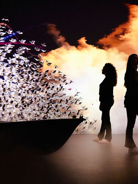 Guests at the Remastered audiovisual experience in Rotterdam with dynamic light display.