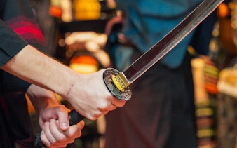 Samurai sword being held during a Tokyo swordplay experience.