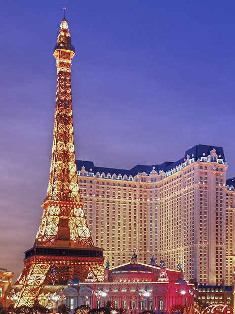 Eiffel Tower replica illuminated at Paris Las Vegas Hotel.