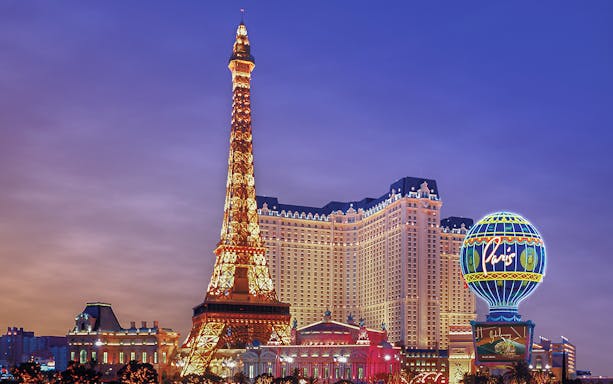 Eiffel Tower replica illuminated at Paris Las Vegas Hotel.
