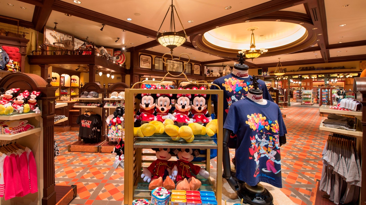 Disneyland Hong Kong shop with Mickey and Minnie merchandise displays.