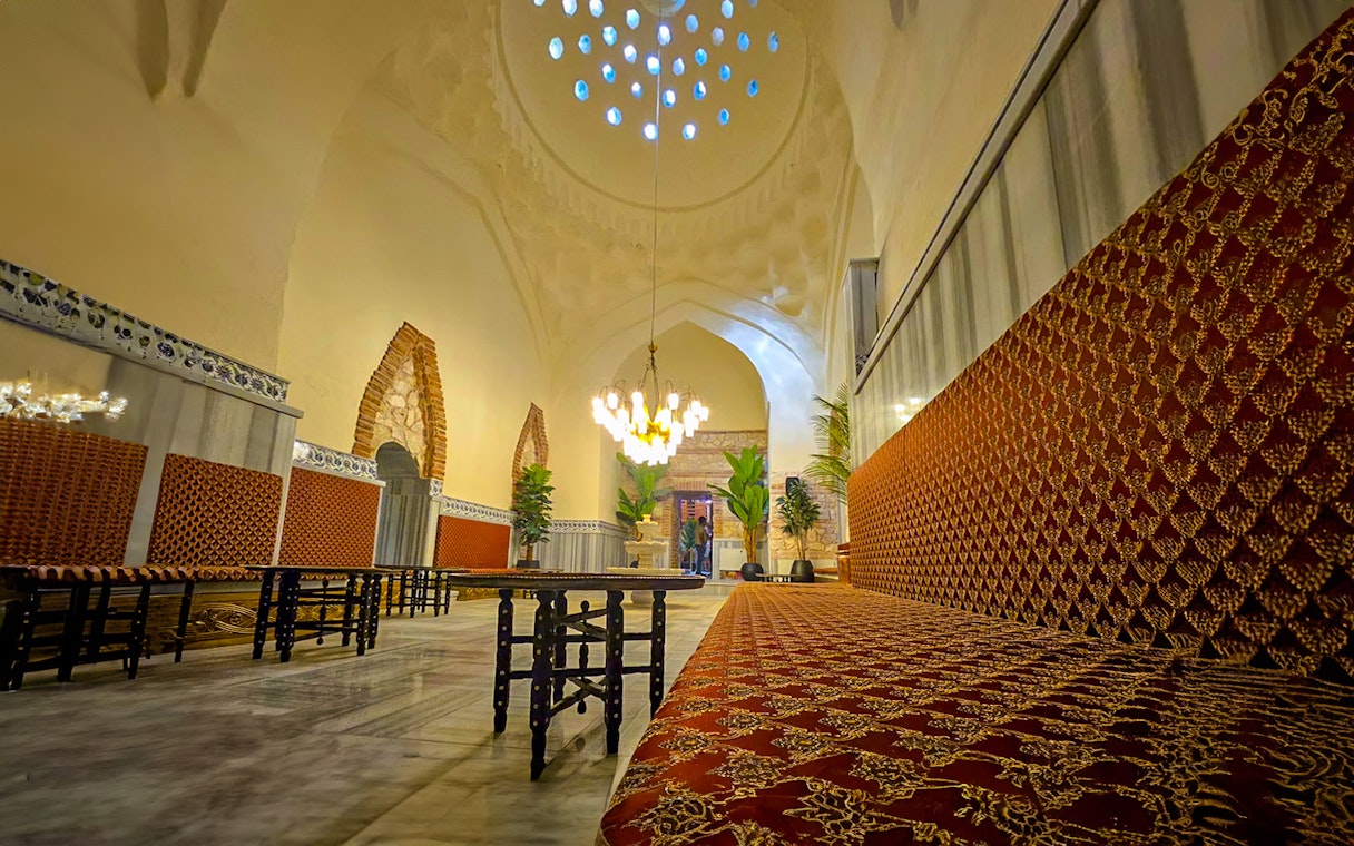 Gedikpasa Historical Hammam interior with ornate seating and arched architecture.
