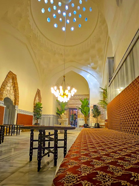 Gedikpasa Historical Hammam interior with ornate seating and arched architecture.