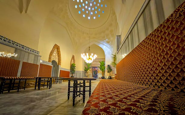 Gedikpasa Historical Hammam interior with ornate seating and arched architecture.