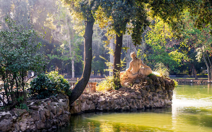 Statue near Temple of Esculapio in Villa Borghese, Pincian Hill, Rome, Italy.