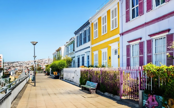 Colorful houses along Paseo Atkinson in Valparaíso, Chile, with a view of the city.