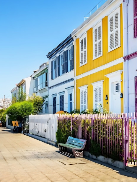 Colorful houses along Paseo Atkinson in Valparaíso, Chile, with a view of the city.