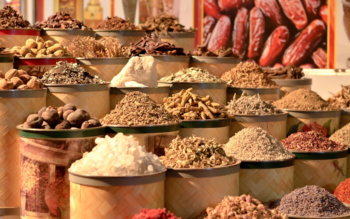 Various spices displayed in baskets at the Gold and Spice Souk.