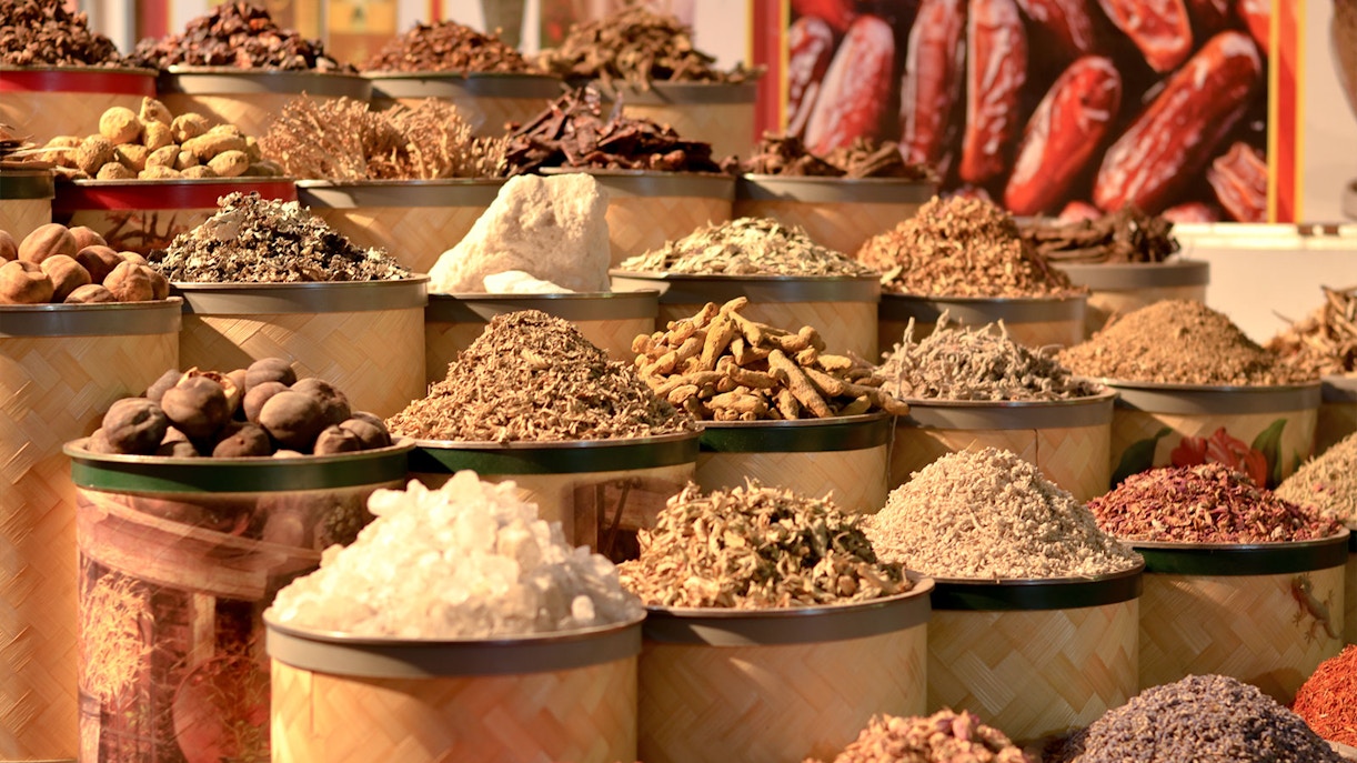 Various spices displayed in baskets at the Gold and Spice Souk.
