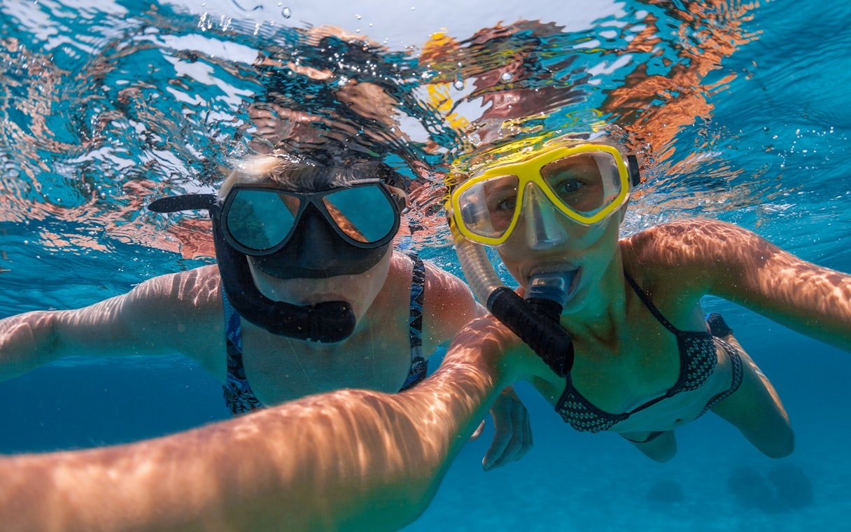 Snorkelers exploring clear tropical waters.