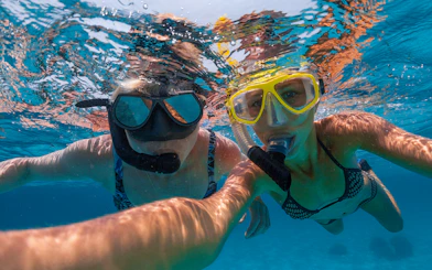 Snorkelers exploring clear tropical waters.