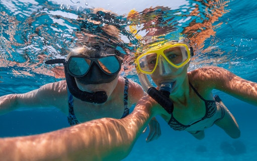 Snorkelers exploring clear tropical waters.