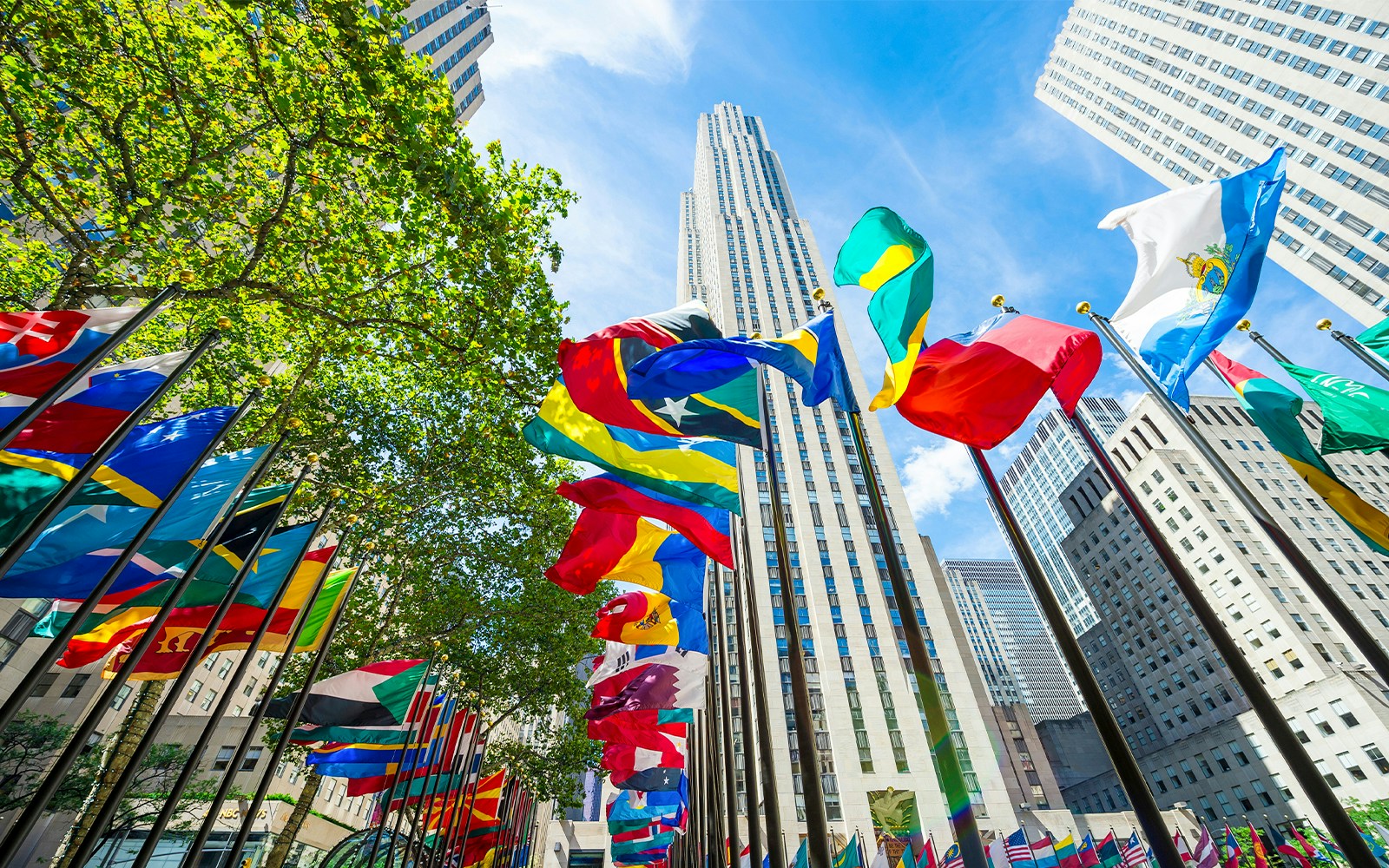 International flags waving in front of Rockefeller Center, Manhattan, NY.