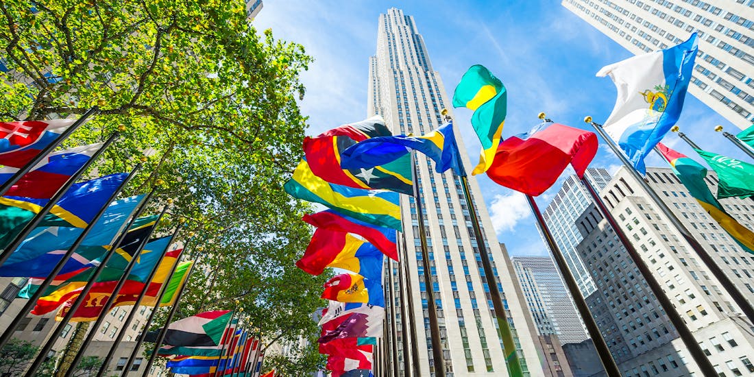 International flags waving in front of Rockefeller Center, Manhattan, NY.