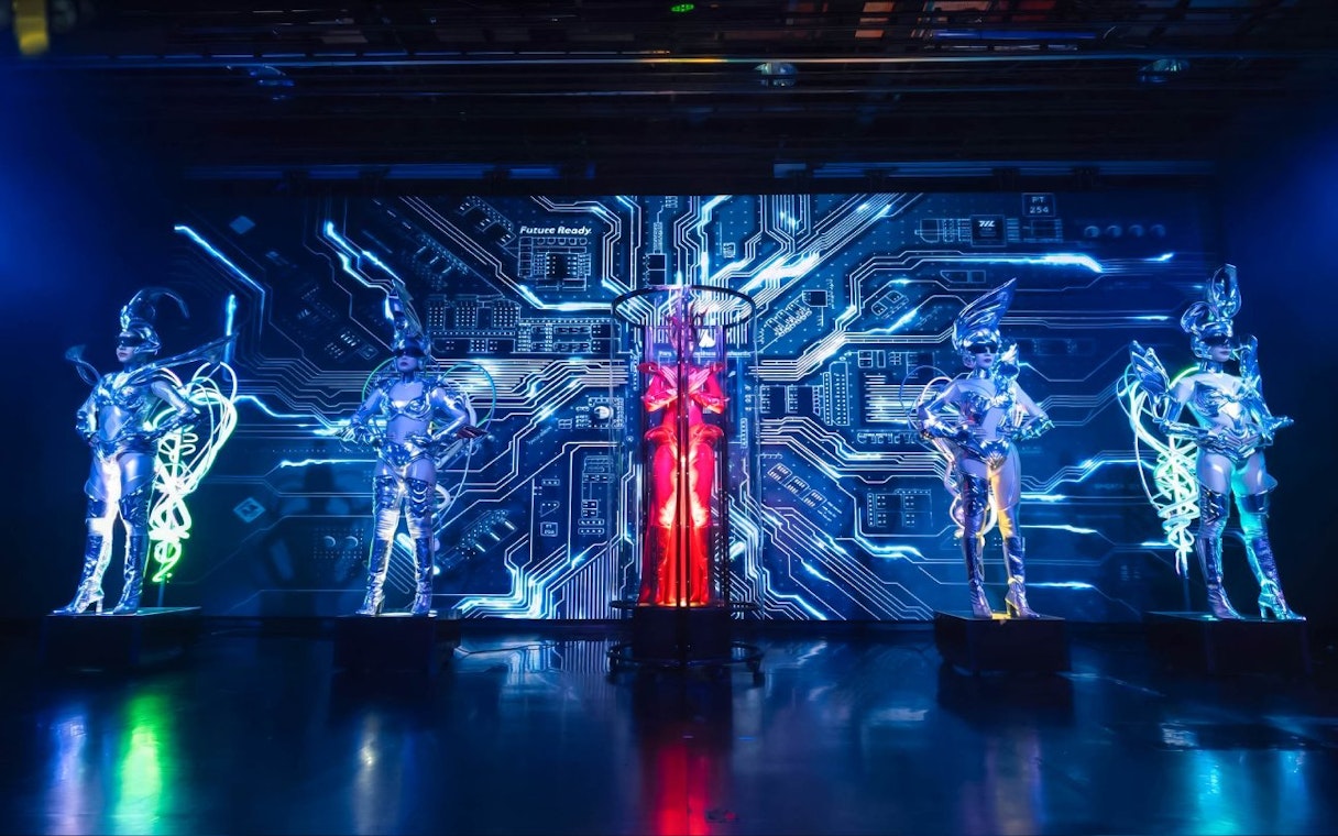 Performers in futuristic costumes at Calypso Cabaret show, Bangkok.