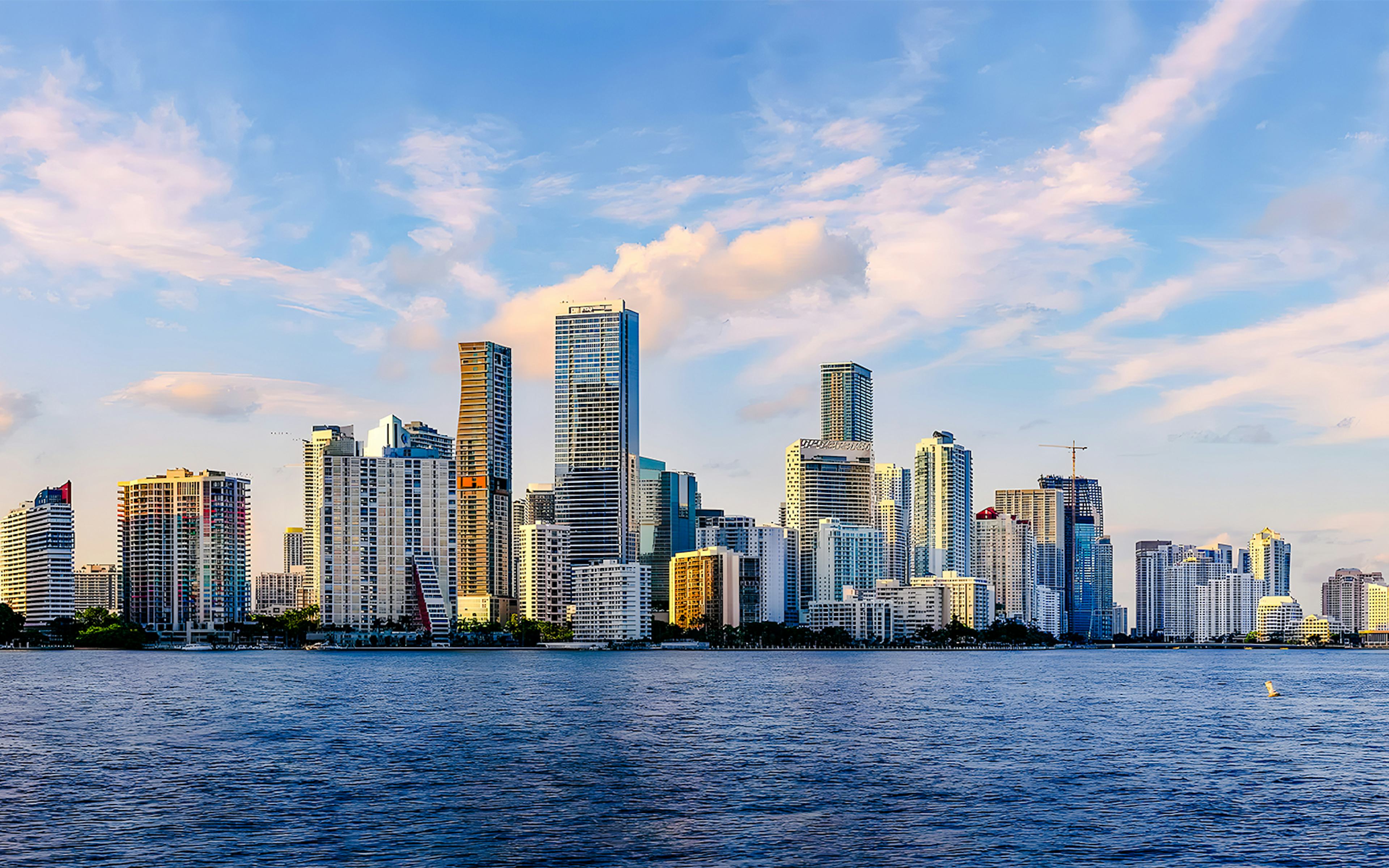 Miami Brickell skyline with high-rise buildings and Biscayne Bay in the foreground.