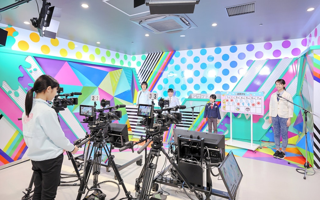 Children participating in a broadcast activity at KidZania Fukuoka.