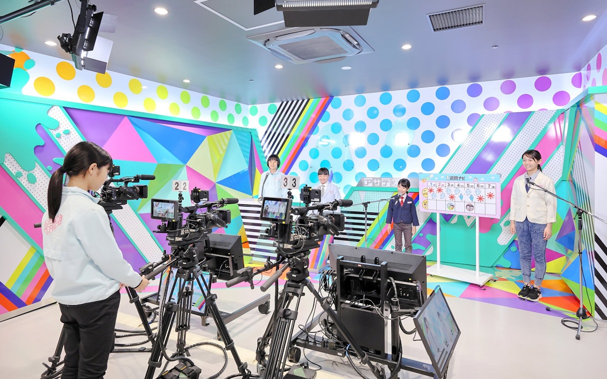 Children participating in a broadcast activity at KidZania Fukuoka.