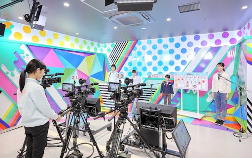 Children participating in a broadcast activity at KidZania Fukuoka.