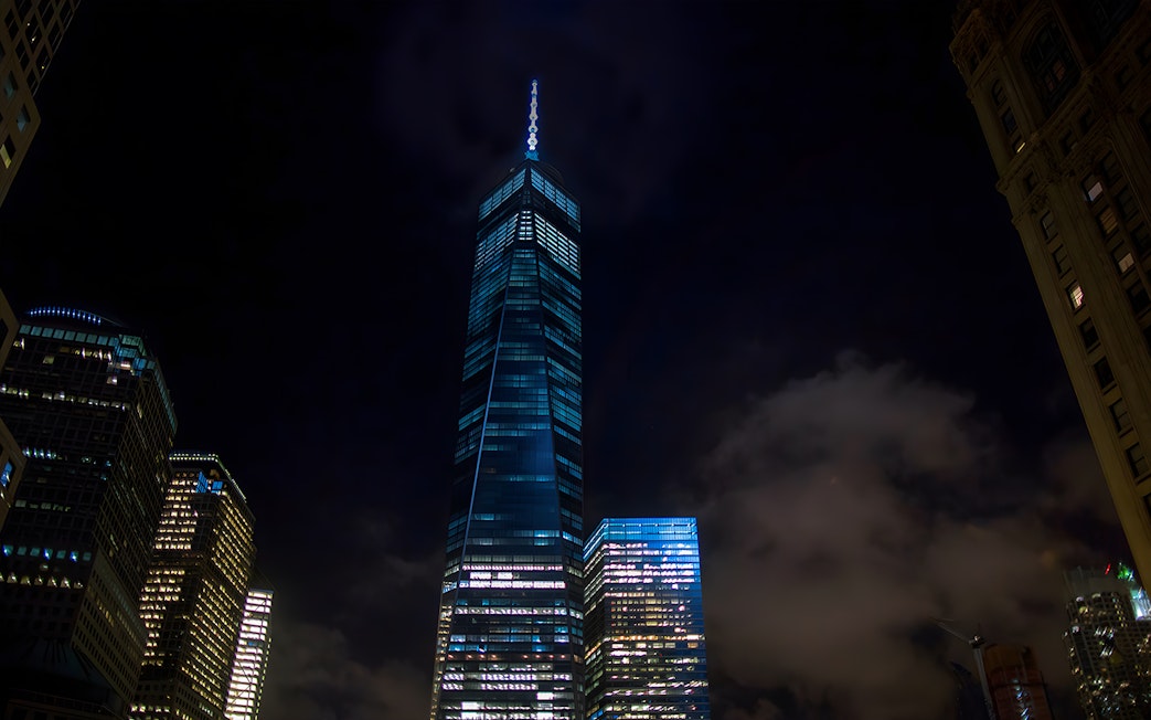 Skyscrapers illuminated at night during Big Bus New York Night Bus Tour.
