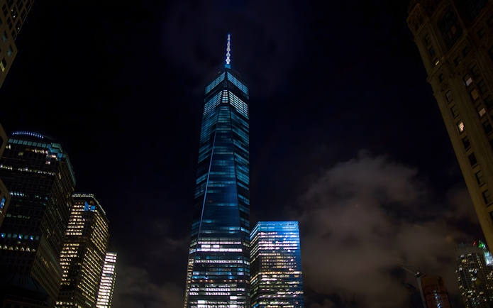 Skyscrapers illuminated at night during Big Bus New York Night Bus Tour.