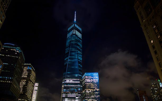 Skyscrapers illuminated at night during Big Bus New York Night Bus Tour.