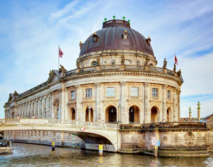Bode Museum with dome and bridge over Spree River, Berlin, Germany.
