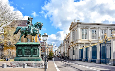 Equestrian statue and historic buildings on Noordeinde street, City Center, the Netherlands.