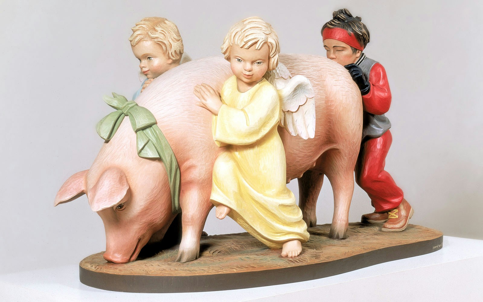 Sculpture of children and pig from Jeff Koons' Ushering in Banality Exhibit at Stedelijk Museum.