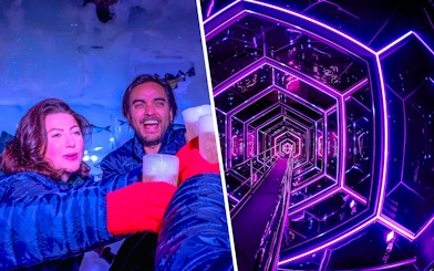 Guests enjoying drinks at Xtracold Icebar and neon-lit tunnel at Inside Amaze Amsterdam.