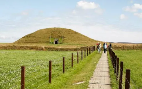 Pathway leading to Maeshowe chambered cairn on Orkney Heritage Tour.