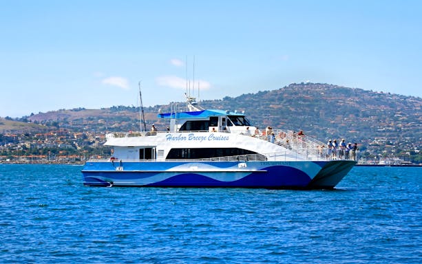 Whale watching boat on Los Angeles tour with passengers viewing ocean.