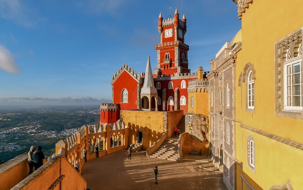 National Palace of Pena in Sintra with colorful towers and scenic views.