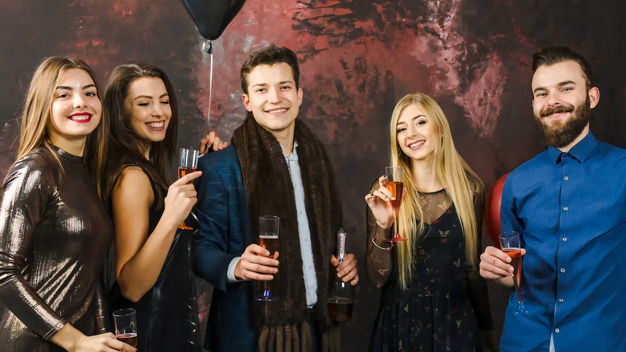 Guests enjoying drinks at the World of Illusions event.