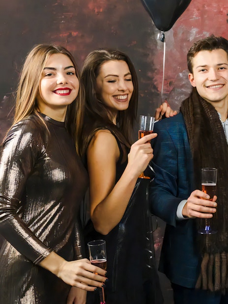 Guests enjoying drinks at the World of Illusions event.