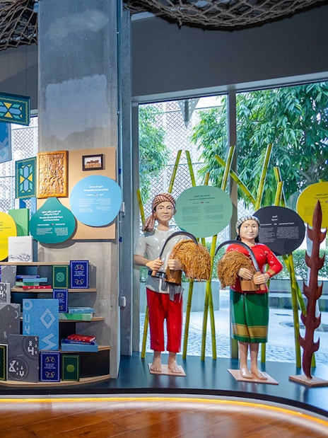 Exhibit featuring cultural artifacts and statues at Expo City Dubai.