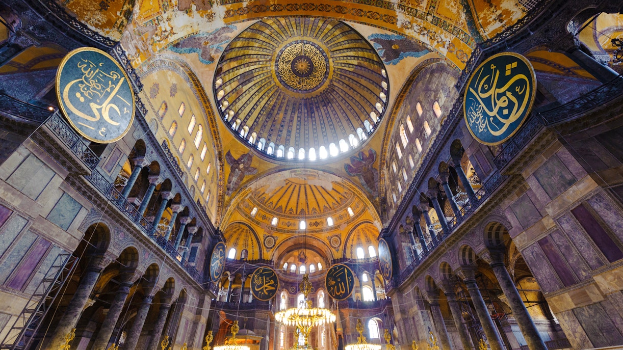 Hagia Sophia interior with ornate dome and Islamic calligraphy, Istanbul, Turkey.
