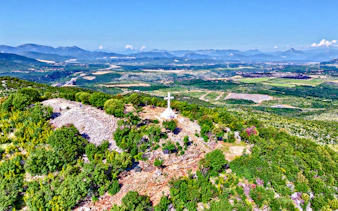 Mount Križevac cross overlooking Medjugorje landscape in Bosnia and Herzegovina.